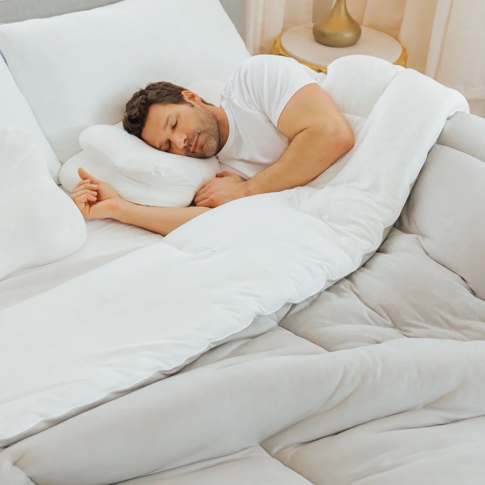 Man sleeping on his side with an OrthoAlign contour pillow