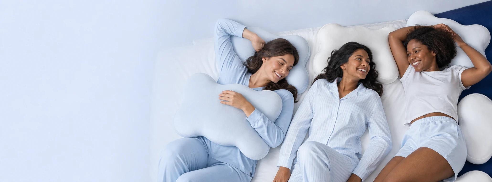 Three women relaxing with tag-free CloudAlign pillows